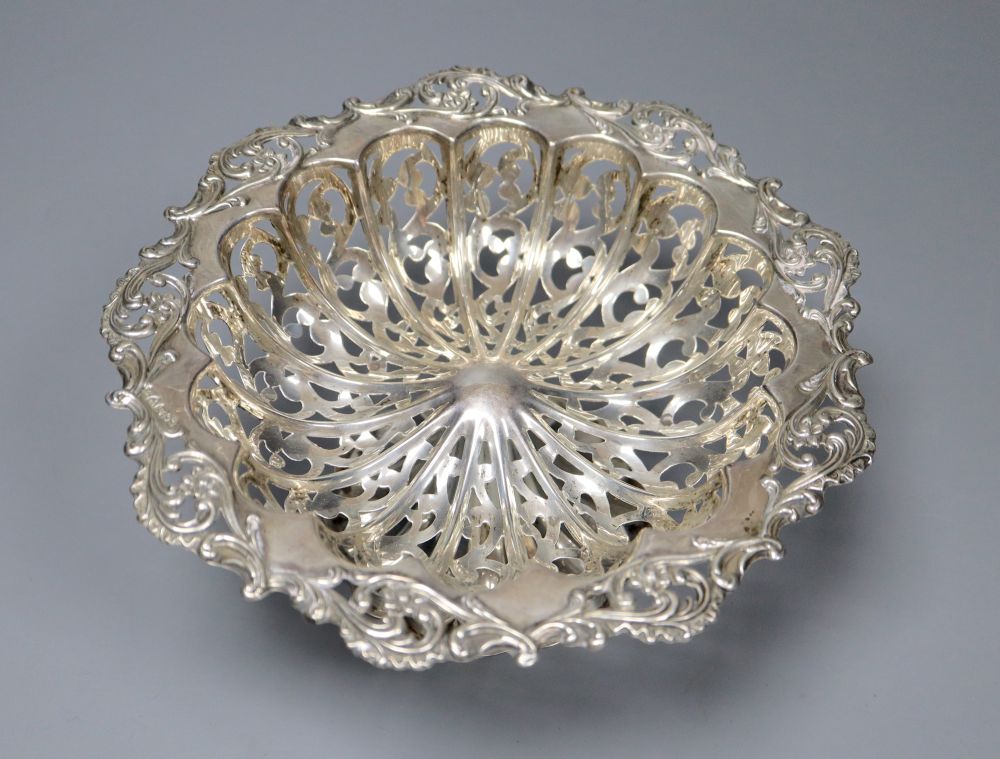 A pierced and embossed silver footed bowl, maker C.C, Chester 1907 and two silver sugar bowls, approx 13oz